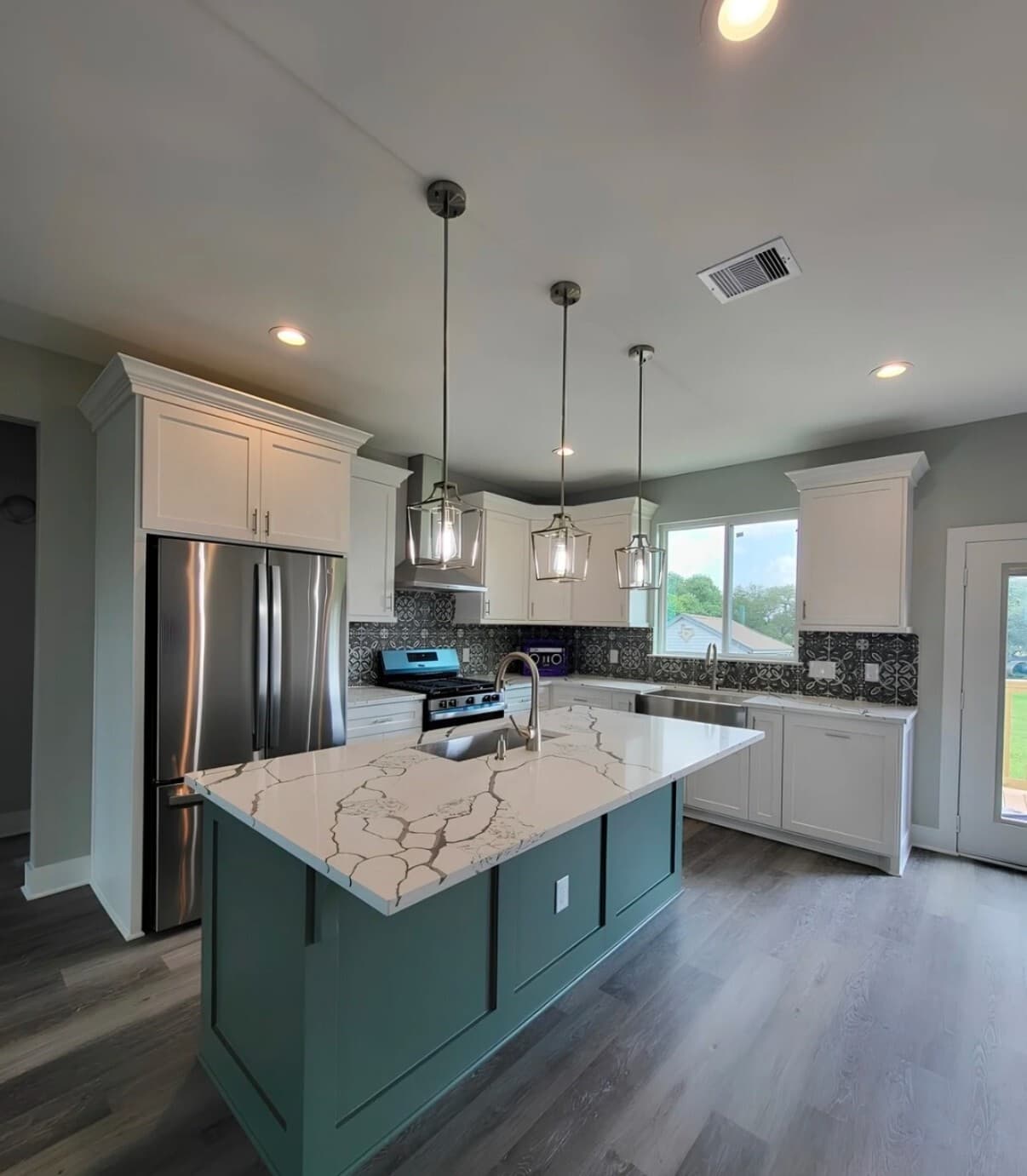 Giddings Homestead kitchen with a large island and two-tone cabinetry